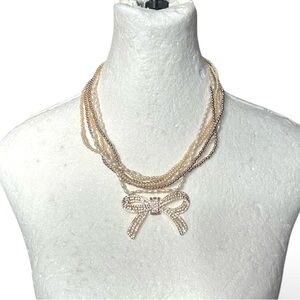 Elegant Pearl and Crystal Bow Necklace